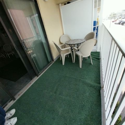 Private balcony seating at SeaSide Getaway